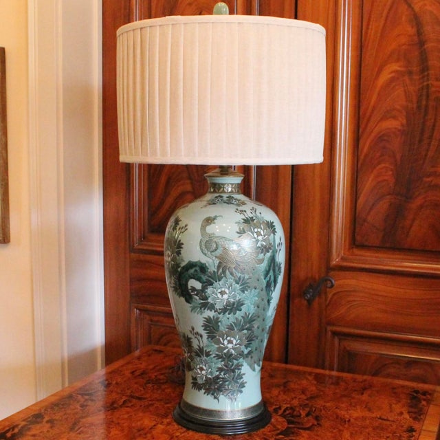A stunning Satsuma porcelain composition in turquoise and green with gilt highlights and details, the large peacock is...