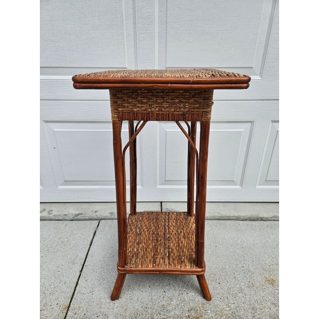 Palecek is known for quality rattan furnishings, and this square woven rattan and bamboo two-tier side table is no...