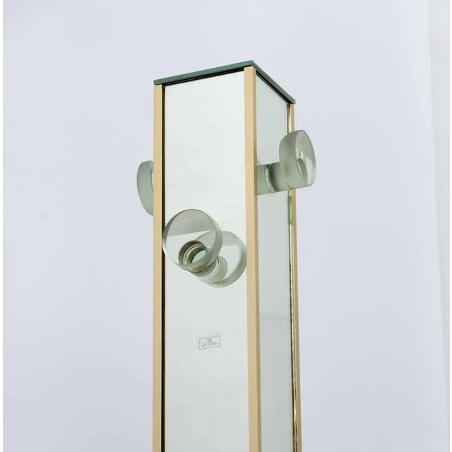 Mirror hanger produced by the well -known Italian company, production in the 70s. Composed of four high thick glass...