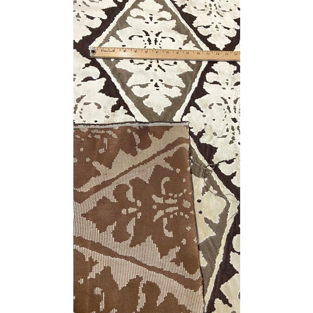 This luxurious fabric is cut velvet jacquard with a diamond damask design, It has a dark taupe, khaki, and ivory...