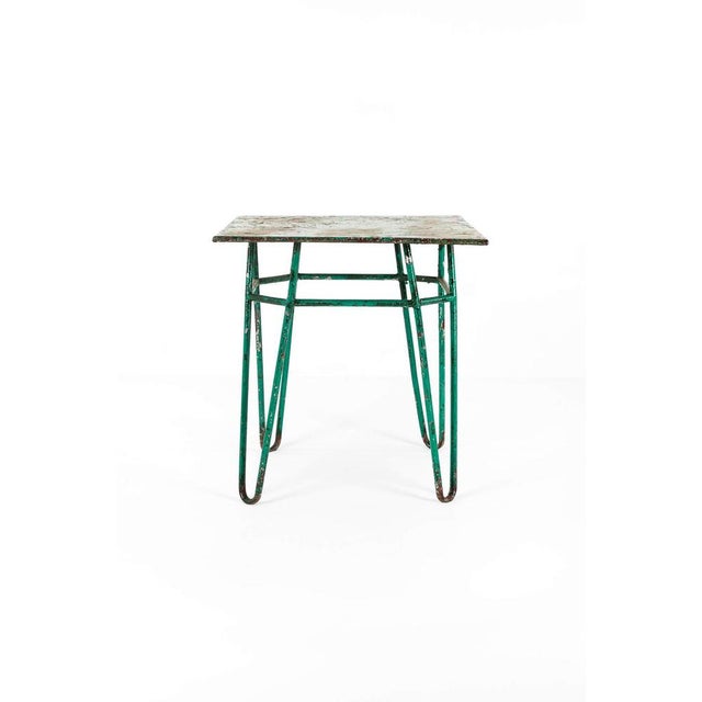 A fabulous continental tubular bistro table in original vibrant green paint. The smooth square top rests on double tubular...