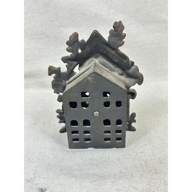 Vintage cast iron painted penny bank titled “Bears Stealing Honey” showing two bears at a barrel of honey. This is a pre-...