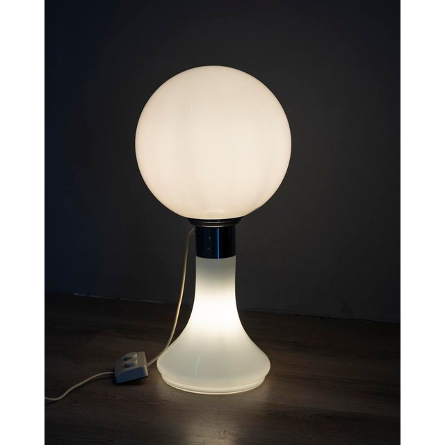Double-switch table or floor lamp, in white opal glass with central chromed metal support, Italian design, 1970s. European...