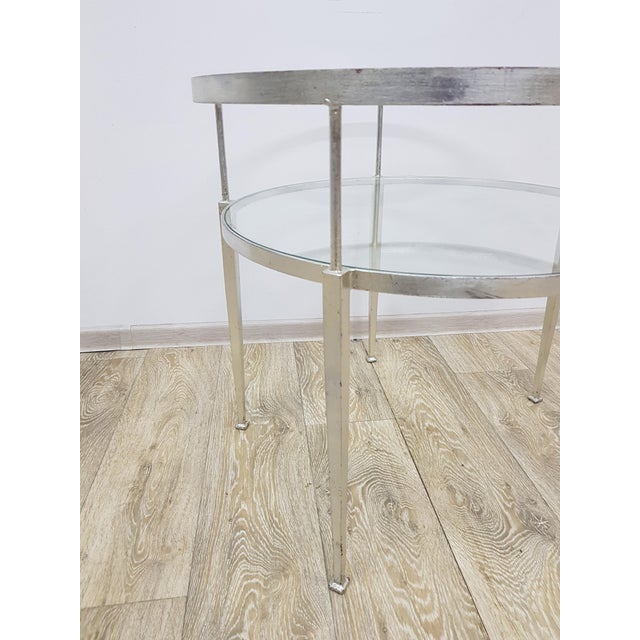 Original industrial coffee table from the 1970s. An impressive table with a solid metal structure and two glass tops. Its...