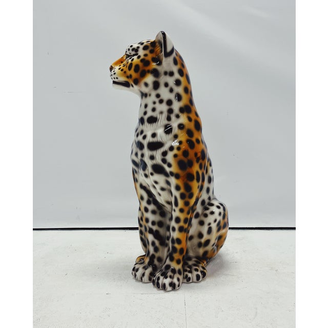 A unique, handmade leopard sculpture. Crafted in Italy from hand-painted ceramic, this Hollywood Regency-style piece will...
