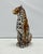 A unique, handmade leopard sculpture. Crafted in Italy from hand-painted ceramic, this Hollywood Regency-style piece will...