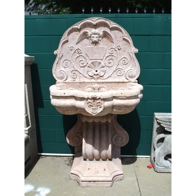 This monumental Italian wall fountain was hand-carved in verona rossa marble in the early 1900’s. Truly the work of a...