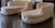 A stunning matching pair of deep button-tufted curved settees in a soft blush pink cotton damask blend — a true "his &...