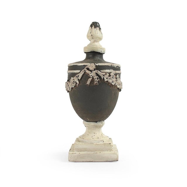 The Resin Urn from Zentique is a compact decorative urn in iron with a classical form. The 12.75" height works on shelves...