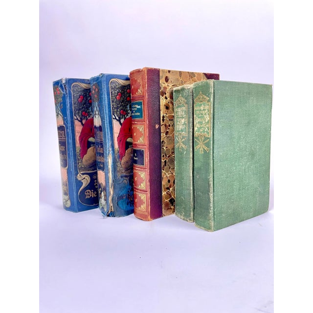 A set of beautifully bound antique books perfect for staging or decorative your bookshelves. Three German titles with...