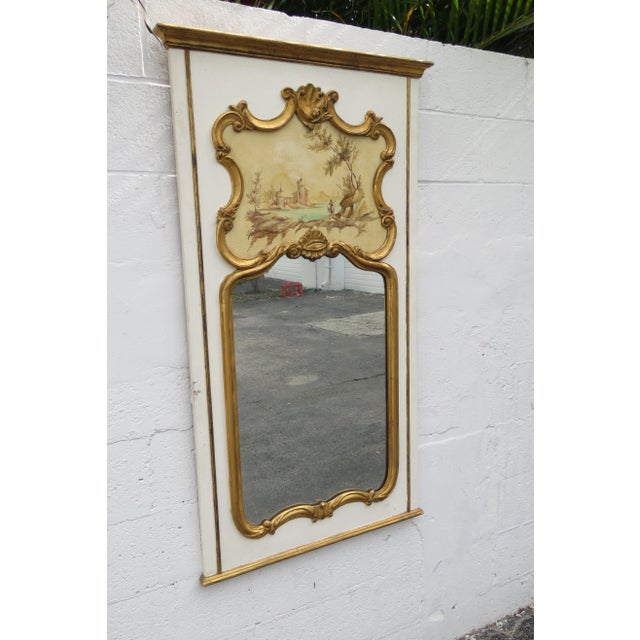 This classic Trumeau Mirror is made out of wood, mirror, and it is in good condition. This Mirror has a beautiful French...