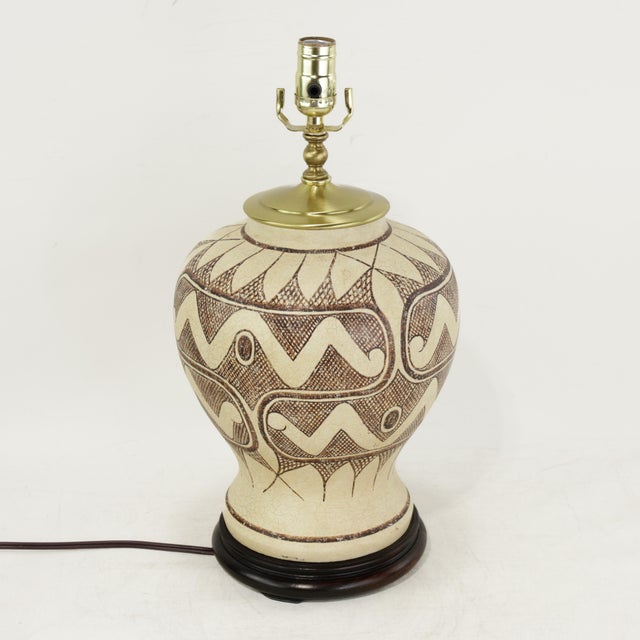 Bring warmth and character to your space with this striking vintage ceramic table lamp featuring an intricate hand-painted...