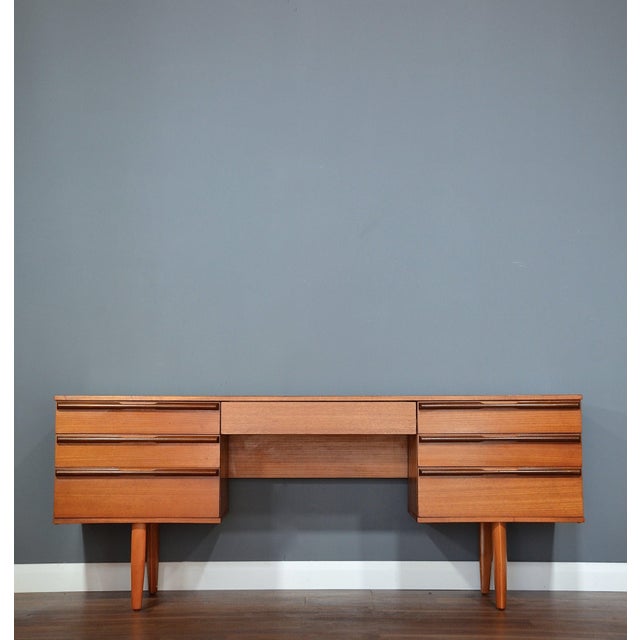 Mid-Century Modern Desk in Teak from Avalon, 1960s, in Very Good conditions. Designed 1960 to 1969 This piece has an...