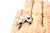 A striking cocktail ring featuring two perched cockatoos, rendered in white gold and pavé-set with round brilliant...