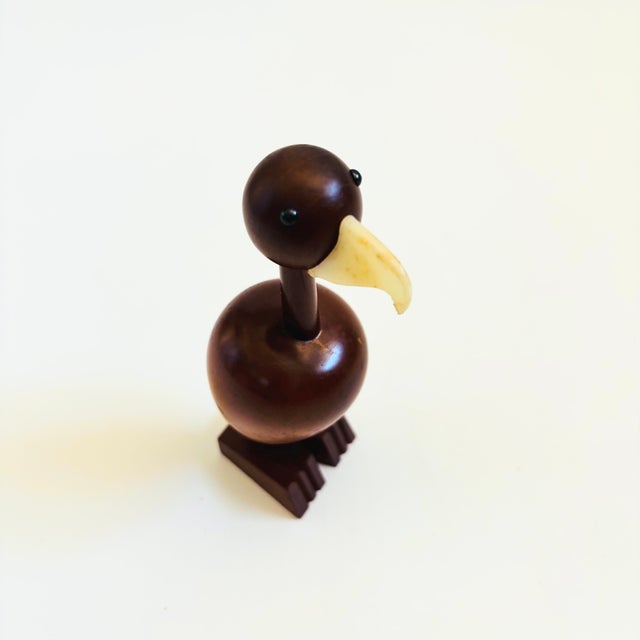 A mid century turned wood figurine in the shape of a condor. Adorable stylized features. Made in Japan by Senshukai as...