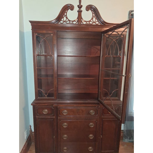 A vintage cherry wood.China hutch. Approximately 17 inch from wall. 72 inches tall approximately 72 in height. 53 inches...