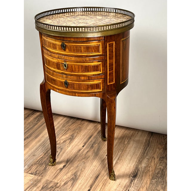 This fine French Louis XV chiffonière table dates to the late 18th century and is beautifully constructed in kingwood with...