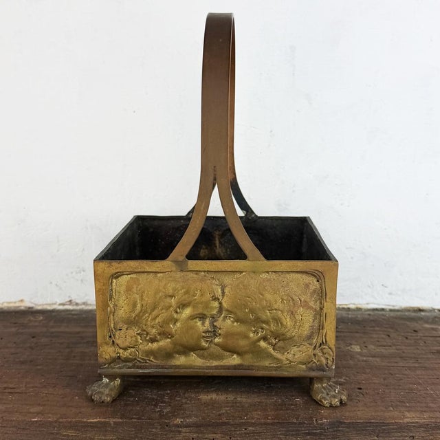Dimensions: 22 × 14 × 14 cm (8.7 × 5.5 × 5.5 in) Antique Art Nouveau brass basket featuring embossed relief panels with...