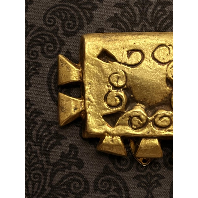 A sculptured bronze brooch with a clip that be used on lapel or as a scarf tie by French Parisian art jewelry designer...