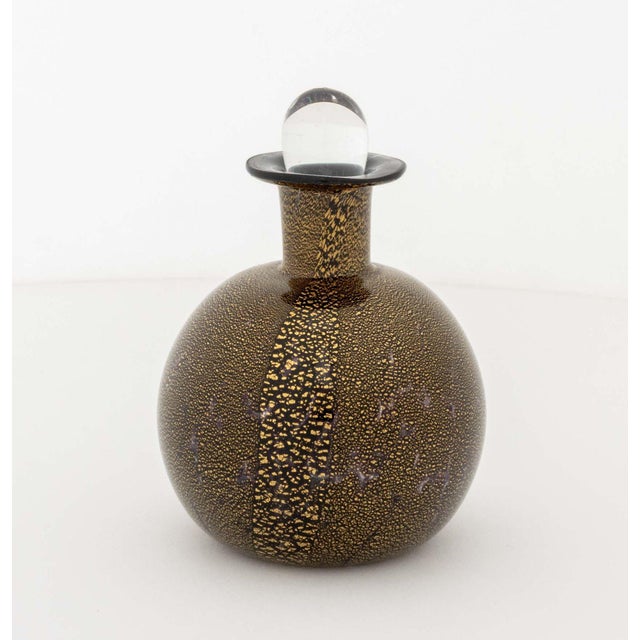 Collection of Nine Art Glass Perfume Bottles, including: a Robert Deeble somerso glass bottle, a Murano gold-flecked black...