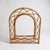 This French rattan wall mirror features a mid century vintage arch design with a woven frame, crafted to bring a stylish...
