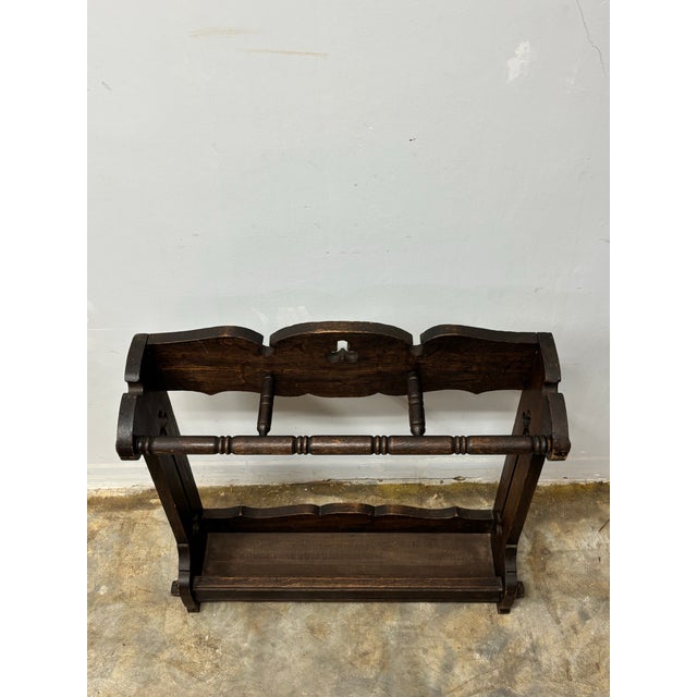 Rooted in the quiet ideals of the Arts and Crafts movement, this vintage English oak umbrella and stick stand speaks to a...