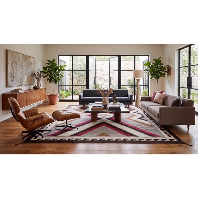 Elevate high-end interiors with this striking contemporary flat-weave wool rug, featuring classic Navajo-inspired regional...