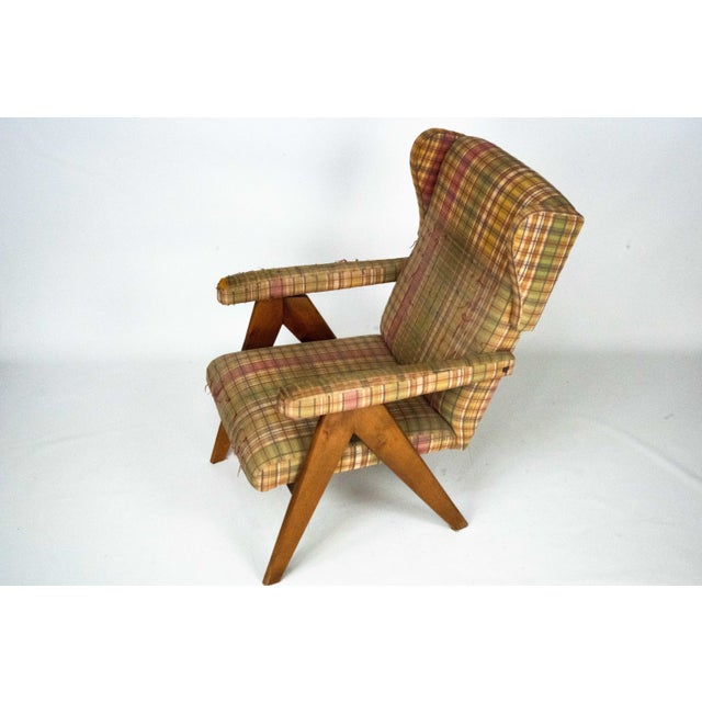 Italian mid-century modern reclining armchair from the 1960s, featuring a sculptural solid wood frame with angular legs...