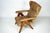 Italian mid-century modern reclining armchair from the 1960s, featuring a sculptural solid wood frame with angular legs...
