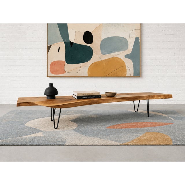A striking live-edge slab that works equally well as an exceptionally long coffee table, low bench or sculptural display...
