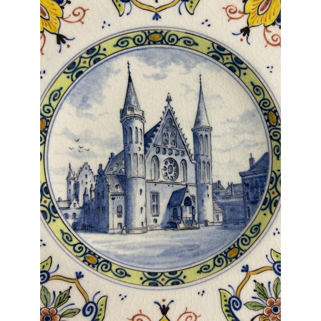Limited edition hand-painted Royal Delft / De Porceleyne Fles wall plate, made in 1975 for Monumentenjaar. The centre...