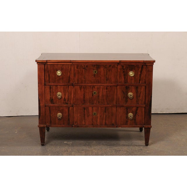A German chest of drawers, with furniture maker mark by Konz Lagerhausen, from the 19th century. This antique chest from...