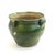 This antique ceramic Anduze pot is made of terracotta and features a green glaze that has been charmingly weathered and...