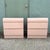 A striking pair of vintage Postmodern nightstands featuring a soft pink high-gloss laminate finish and classic waterfall...