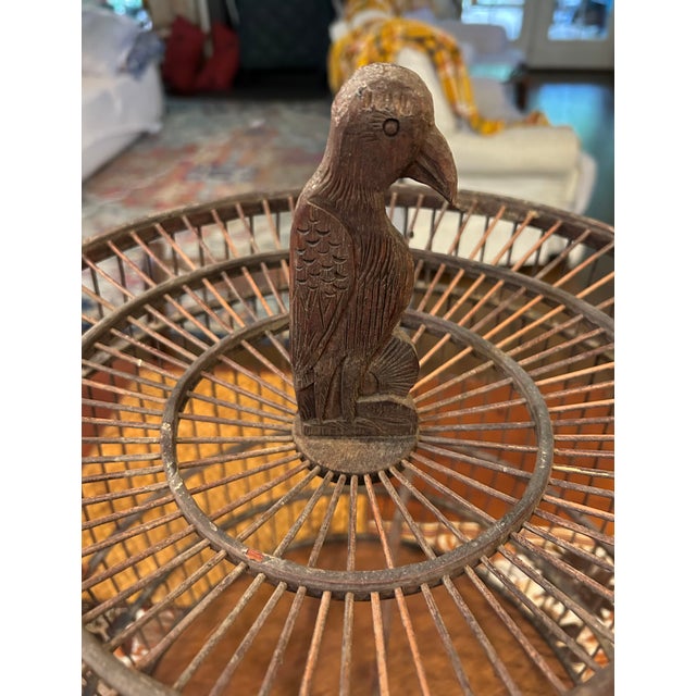 Add a touch of rustic charm and craftsmanship to your home décor with this unique vintage wooden bird cage. Expertly...