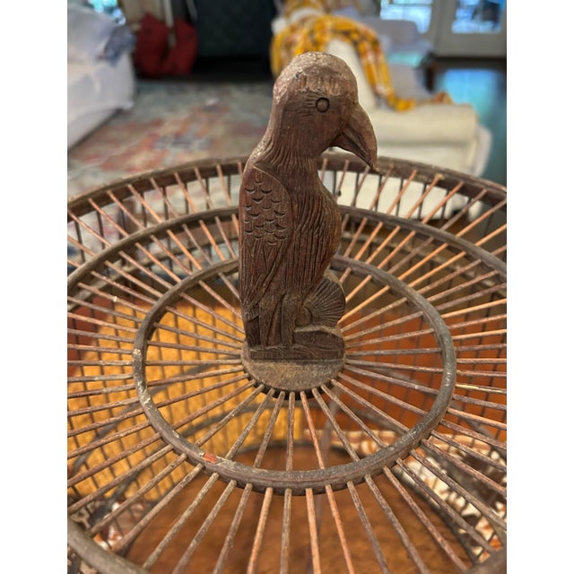 Add a touch of rustic charm and craftsmanship to your home décor with this unique vintage wooden bird cage. Expertly...