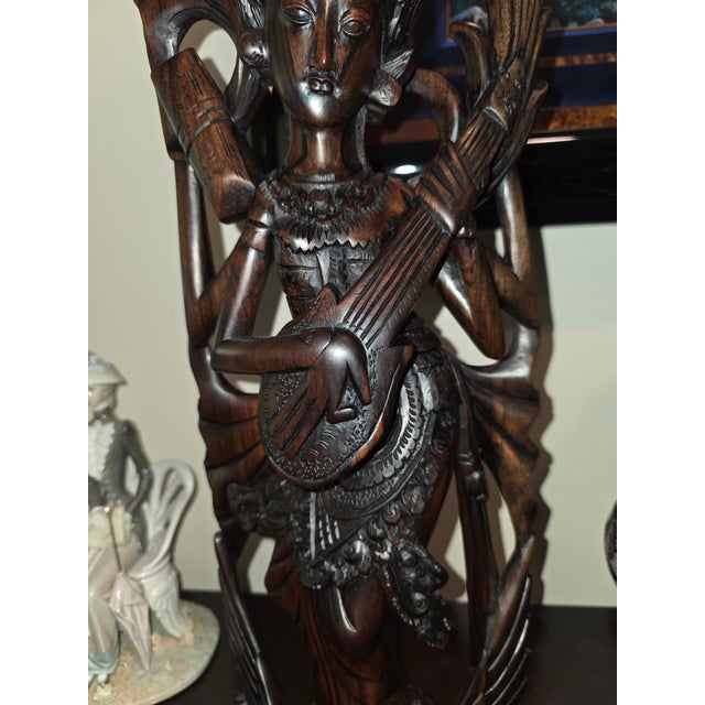 Overview An exceqptional, gallery-grade Mid-Century Balinese modernist openwork sculpture depicting the Hindu Goddess...