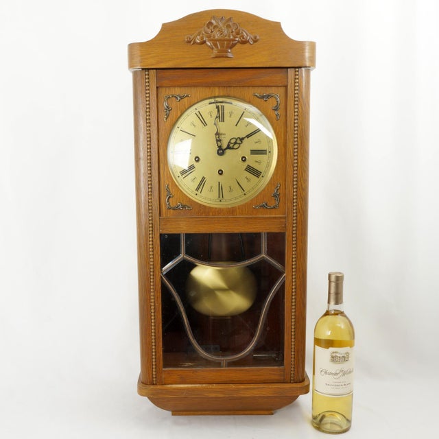 A vintage mechanical wall clock manufactured by Anker in Germany, dating from the mid-20th century (circa 1950s–1970s). It...