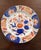 Set of 12 Imari-style porcelain dinner plates from Andrea by Sadek. The plates are each hand painted in cobalt blue, red-...