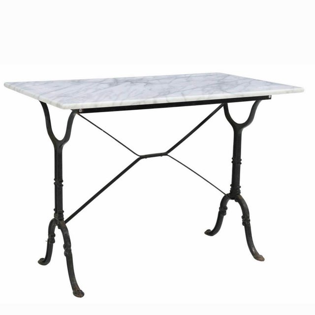 French bistro table, early 20th century, rectangular marble top, cast iron base with cross stretcher Dimensions: Width:...