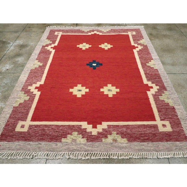 A vintage Swedish Scandinavian flatweave Kilim room size carpet handmade during the Mid-20th Century. Measures: 9' 1" x...