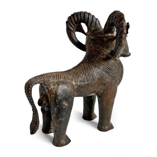 Antique Benin bronze ram figure from Nigeria. This sculptural work embodies the strength, vitality, and ceremonial...