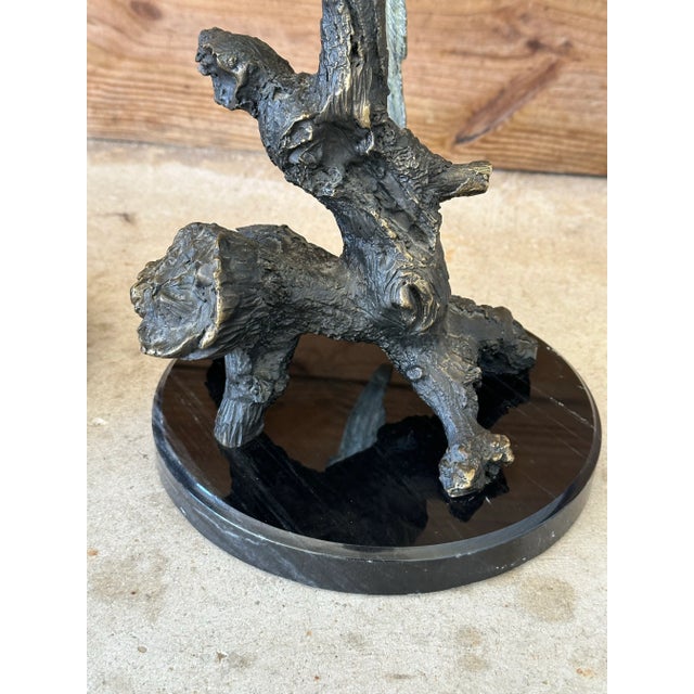 Fabulous pair of hand painted bronze parrot Statues on marble bases by SPI. Beautiful and heavy pieces great for a coastal...