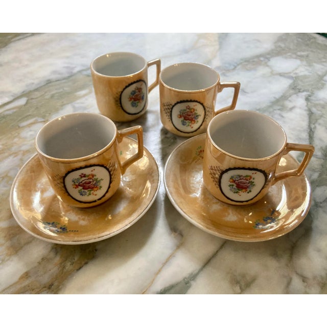 1940s Japanese Porcelain Orange Floral Lustreware Demitasse Set of Four Cups with matching pair of Two Saucers. Featuring...