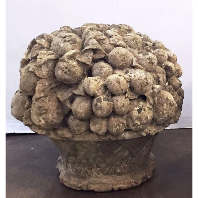 An English garden ornamental sculpture of a fruit basket (or bouquet) - of composition stone - featuring a variety of...