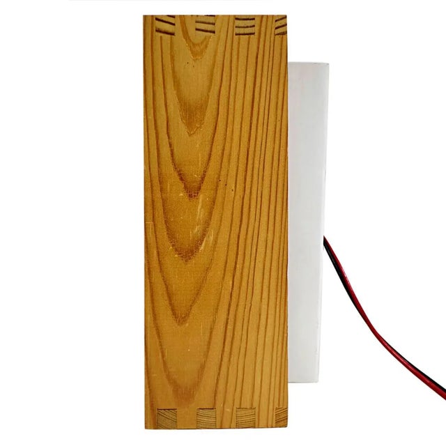 Rare ceiling light made of wood with a steel base that is attached to the ceiling. The joints in the wood construction...