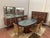 An art deco room featuring exquisite woodwork and crafted from high-quality materials. resting on the bases of the...