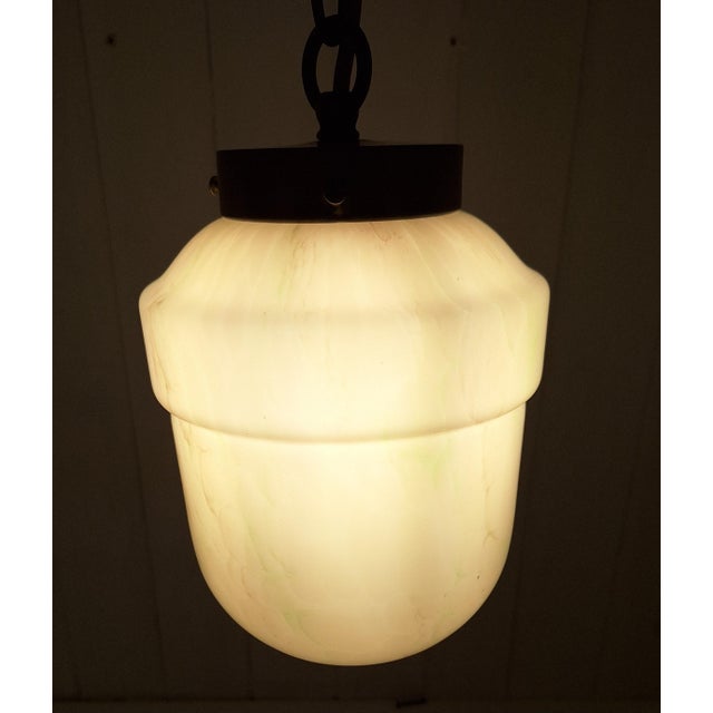 Antique Art Deco German Ceiling Lamp with Pink Marbled Glass Shade on a Brass Mount, 1920s, in Very Good conditions....