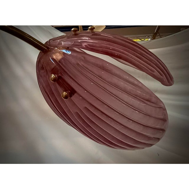 This charming chandelier was made entirely by hand in Murano. Each single leaf is handcrafted in high quality blown Murano...
