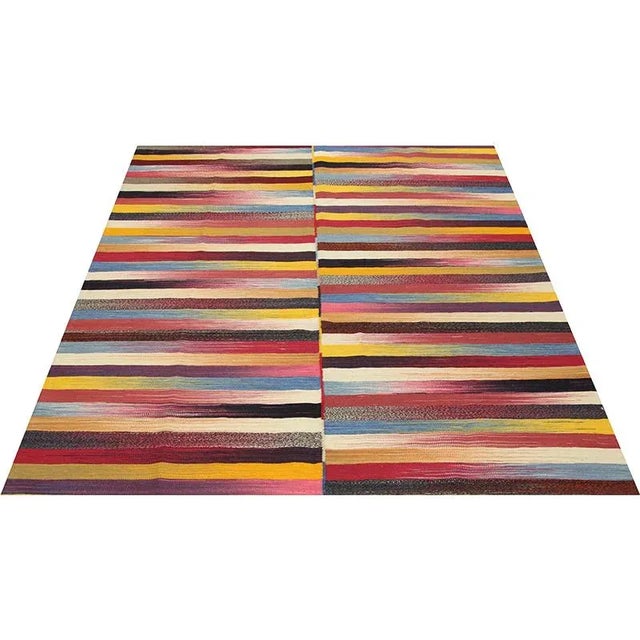 This remarkable contemporary Scandinavian Style Kilim area rug features a dramatic pop of electrifying colors in a...